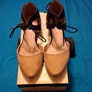 Restricted Tan and Black Pointed-Toe Ankle Tie Heels